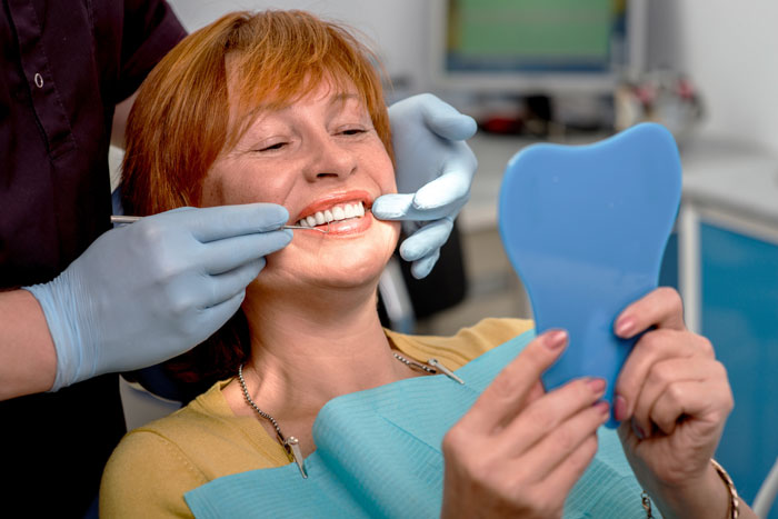 women being scanned by a 3D X-ray machine